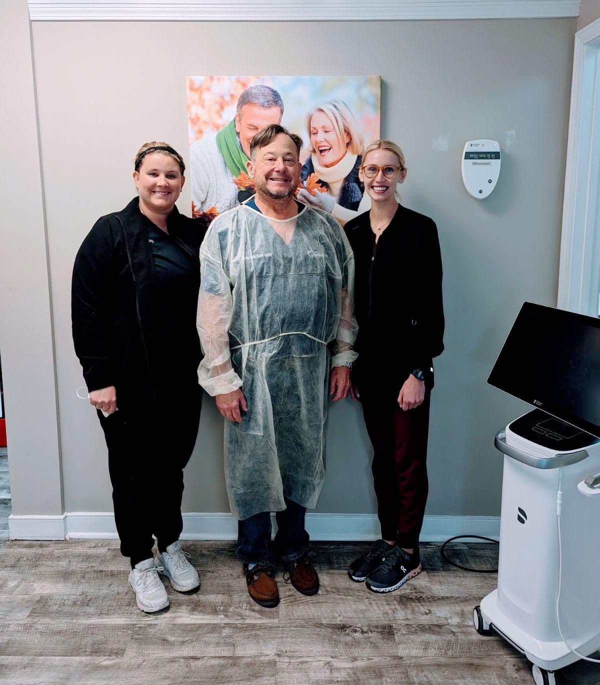 Dr. Hall of Amelia Perfect Smile standing with two FIDA graduate dental assistants